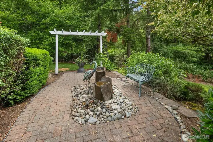 A tranquil fountain welcomes you to the front entrance, creating a peaceful first impression and an inviting place to pause, relax, and take in the beauty of the surrounding landscape. A tranquil fountain welcomes you to the front entrance, creating a peaceful first impression and an inviting place to pause, relax, and take in the beauty of the surrounding landscape.