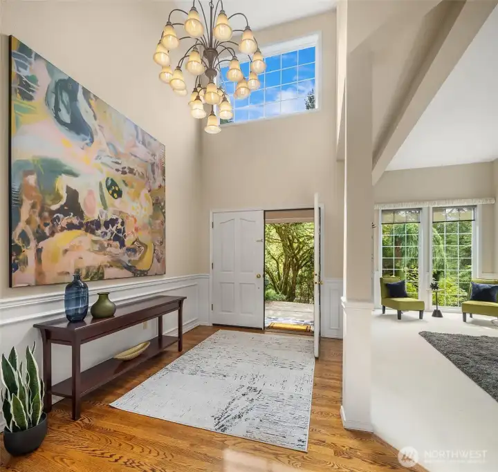 Step into a dramatic entry highlighted by soaring cathedral ceilings and rich oak hardwood floors, setting the tone for the home's timeless elegance. Step into a dramatic entry highlighted by soaring cathedral ceilings and rich oak hardwood floors, setting the tone for the home's timeless elegance.