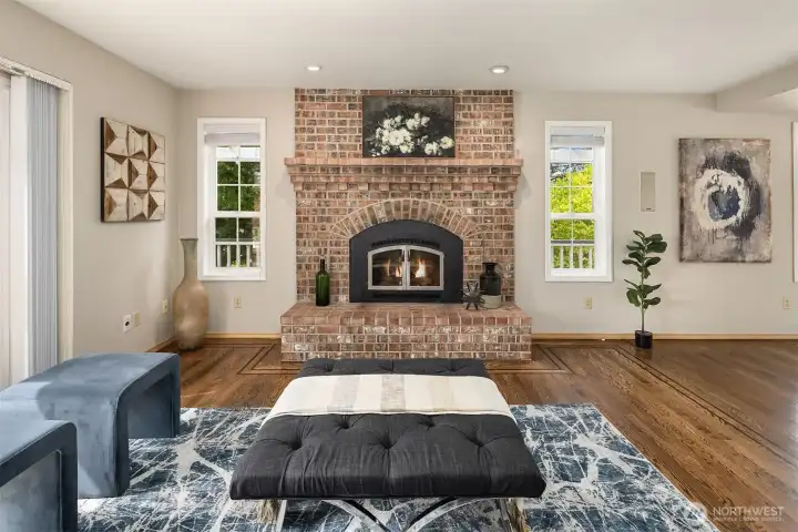 The family room is centered around a striking brick fireplace with a charming hearth, adding warmth, character, and timeless appeal. The family room is centered around a striking brick fireplace with a charming hearth, adding warmth, character, and timeless appeal.