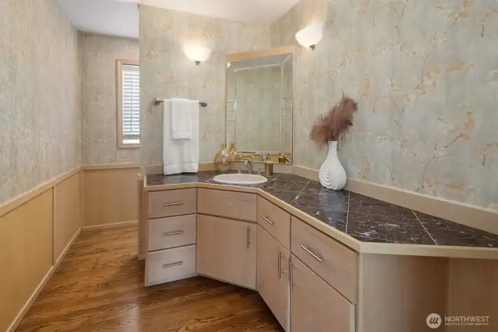 A rare oversized powder room features exceptional space and functionality. A rare oversized powder room features exceptional space and functionality.