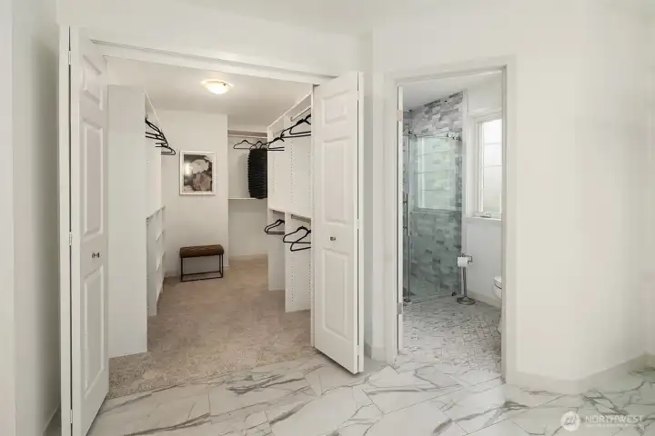 The primary suite also showcases a generous walk-in closet and separate tiled shower. The primary suite also showcases a generous walk-in closet and separate tiled shower.