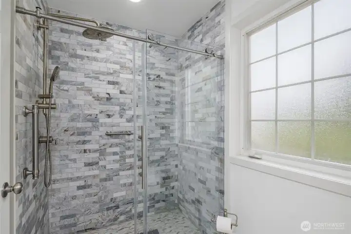 Tiled shower in the primary bath. Tiled shower in the primary bath.