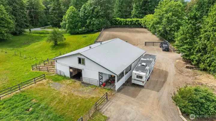 The equestrian facilities include a six stall barn with individual turnouts, dedicated tack and feed rooms, and a spacious hay loft, complemented by a private outdoor riding arena. The equestrian facilities include a six stall barn with individual turnouts, dedicated tack and feed rooms, and a spacious hay loft, complemented by a private outdoor riding arena.