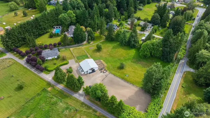 Aerial view showcasing this exceptional five-acre country estate, surrounded by privacy, mature landscaping, and thoughtfully designed amenities. Aerial view showcasing this exceptional five-acre country estate, surrounded by privacy, mature landscaping, and thoughtfully designed amenities.