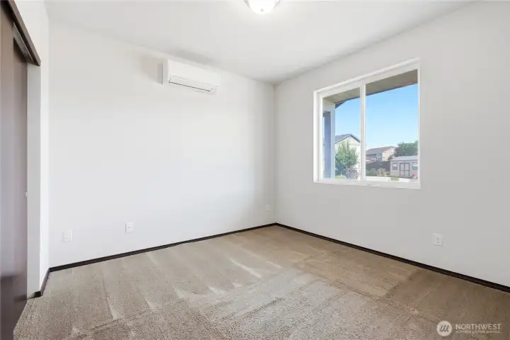 Main floor bedroom is perfect for home office or guest room