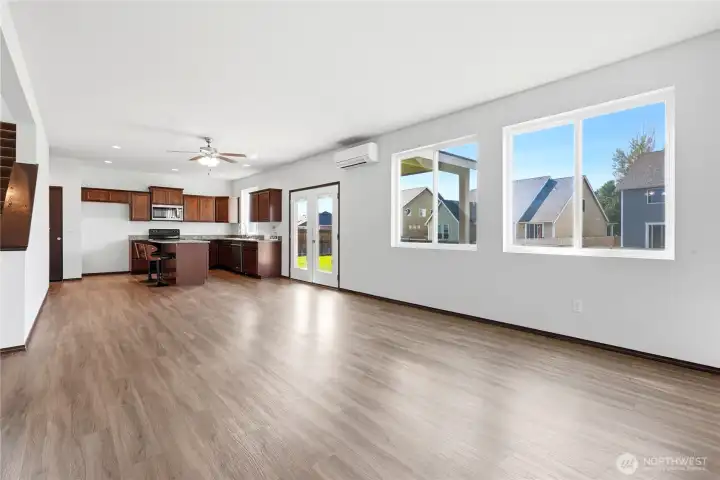 Spacious living room open to eating space & kitchen