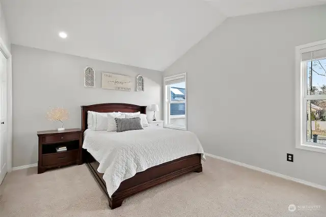 3rd Primary bedroom upstairs. Vaulted ceiling. Over looks backyard.