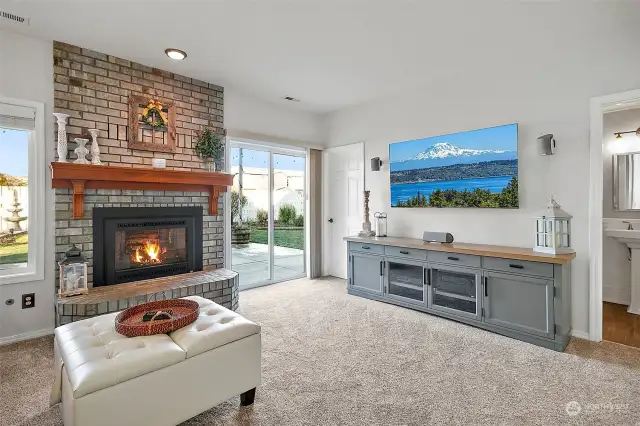 Downstairs family room. New carpet on this level. Gas fireplace.