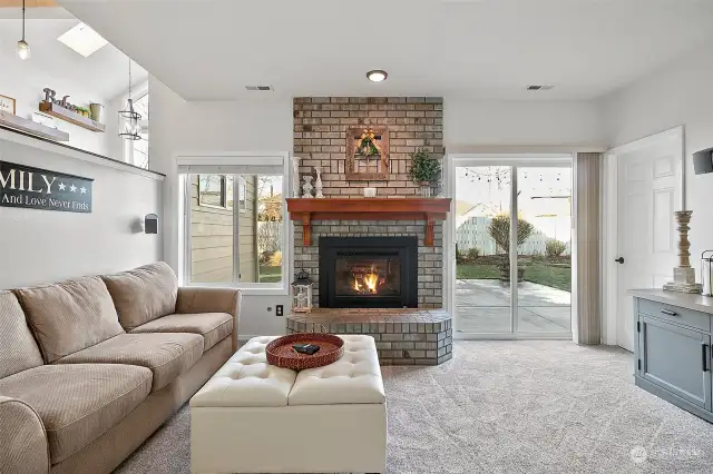 Family room open to kitchen and backyard patio.