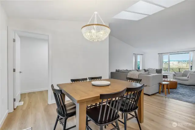 The open dining area seamlessly connects to the kitchen and living space.