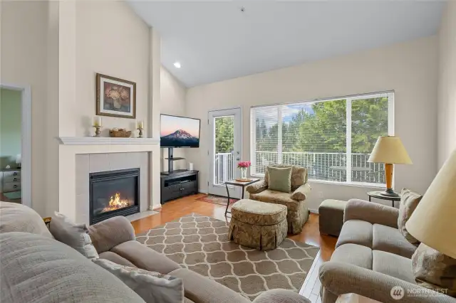 Living room with balcony access that over looks the putt putt golf course.