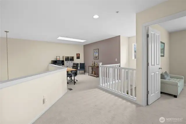 Upstairs open loft area works as a great flex space.