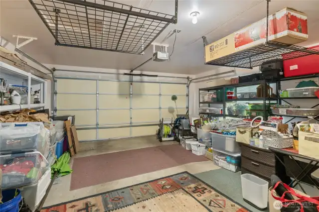 Large garage with overhead storage.