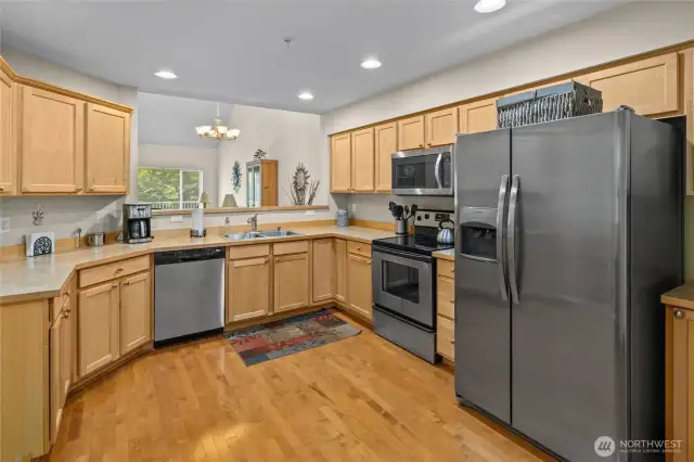 Plenty of counter space in the kitchen with opening into the living room.