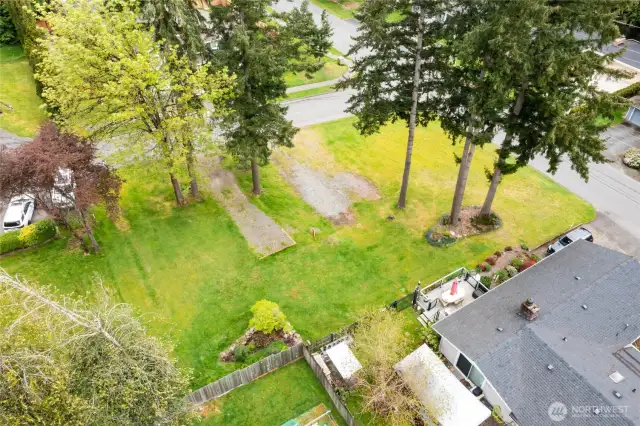 Beautiful, buildable, close-in, corner lot with partially level building area, and gentle slope from West to East