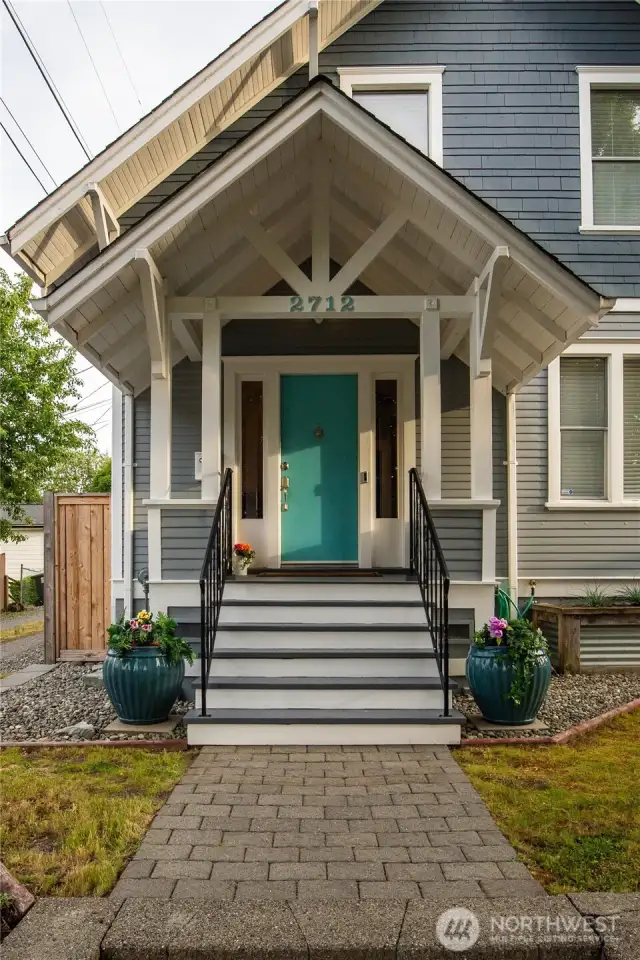 The covered front porch beckons you to come inside.