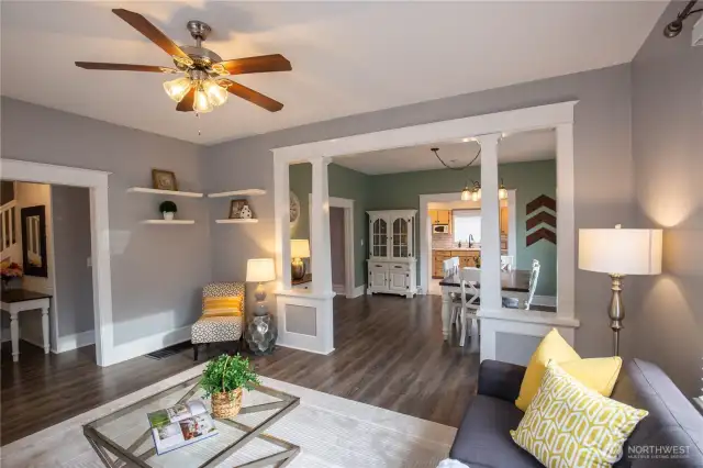 The living room is just off the foyer and flows to the dining room and kitchen.  Gorgeous newer LVP flooring throughout the main and upper level.  The circular floor plan is so practical and feels spacious and open.