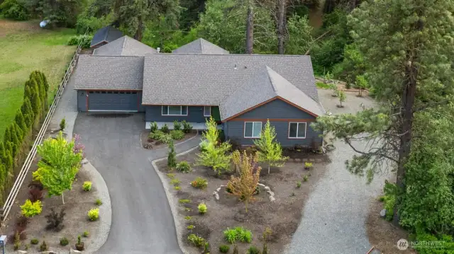 Beautiful landscaping on the triple lot welcomes you to 413 W 6th Street.