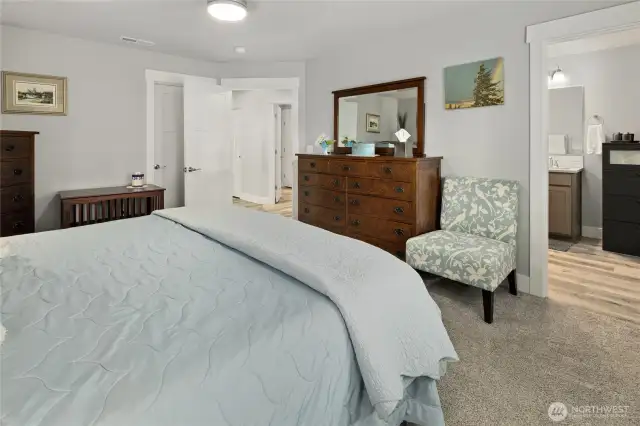 Large walk-in closet to the left and primary bath to the right.