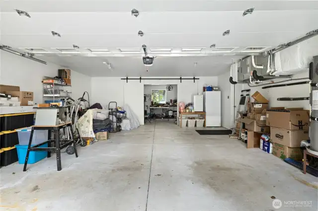 This oversized garage provides parking for up to three cars, with plenty of room left for a workshop or extra storage.