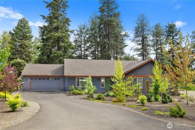 Beautiful landscaping welcomes you to the home.