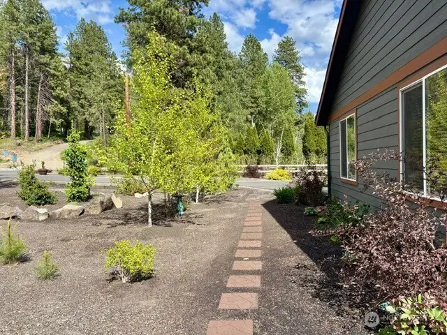 Lovely pavers through landscaped area.