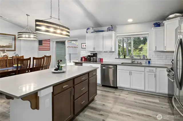 The kitchen island provides extra storage and gathering space.