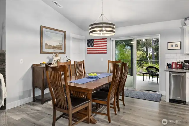 Double sliding doors leading to the outdoor patio are located off the dining room.