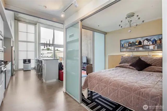 Carpeted bedroom with a chandelier