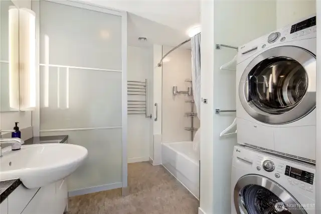 Full Bath with stacked Washer and Dryer