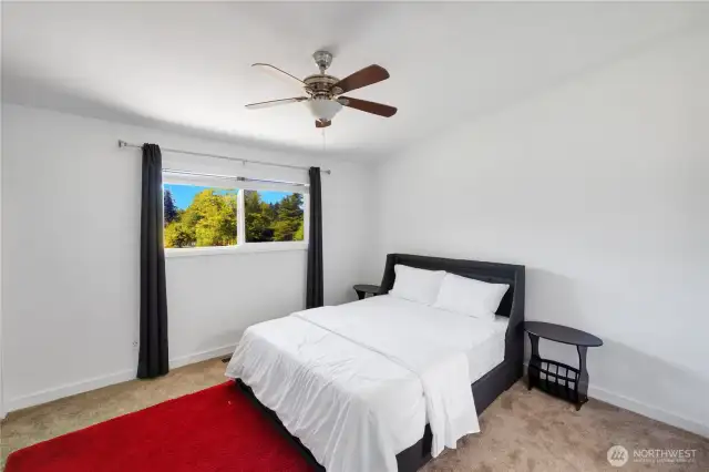Upstairs Bedroom with newly installed carpet.