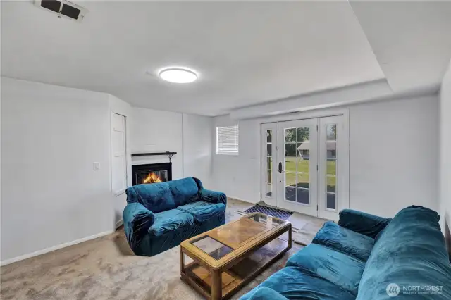 Lower level with Doors exiting to the peaceful back yard.