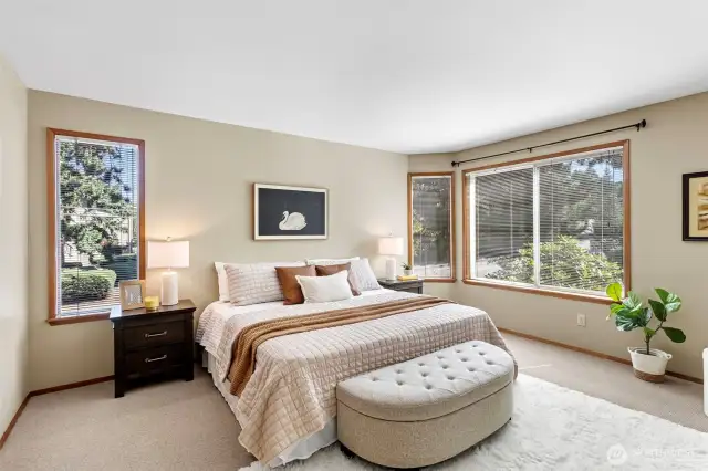 The primary bedroom is large and can easily accommodate a king sized bed and extra furniture.