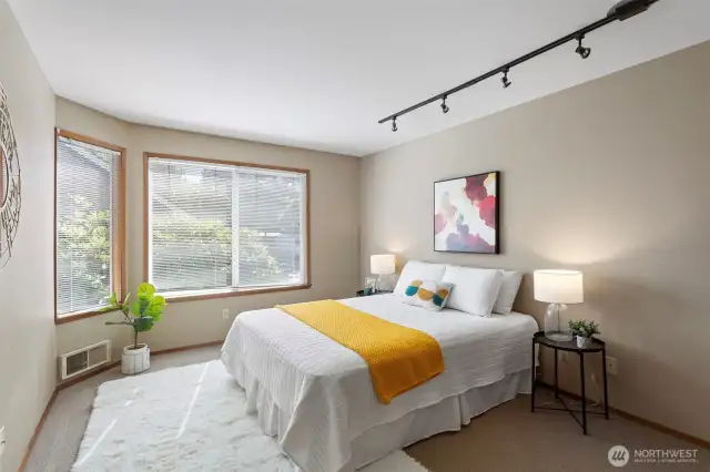 The 2nd bedroom with lots of space, big windows, carpet and designer wall colours.
