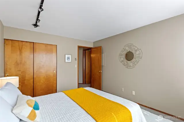 The 2nd bedroom with lots of space, big windows, carpet and designer wall colours