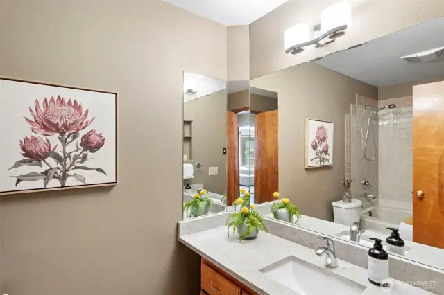 The second bathroom with jetted tub, updated quartz counters and more.