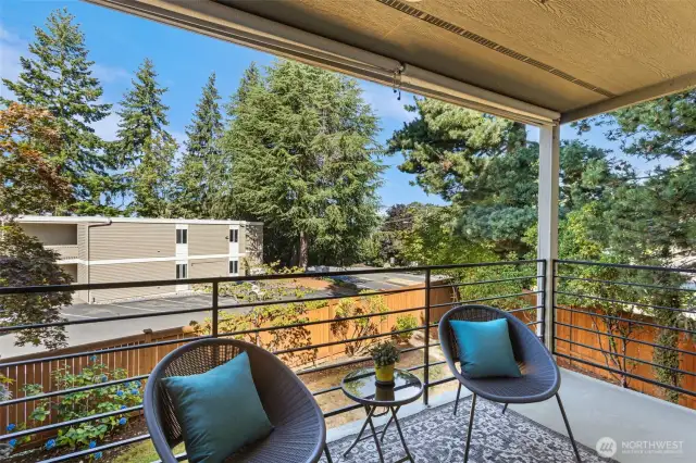Facing west, the balcony off the living room is covered and large enough for outdoor furniture.