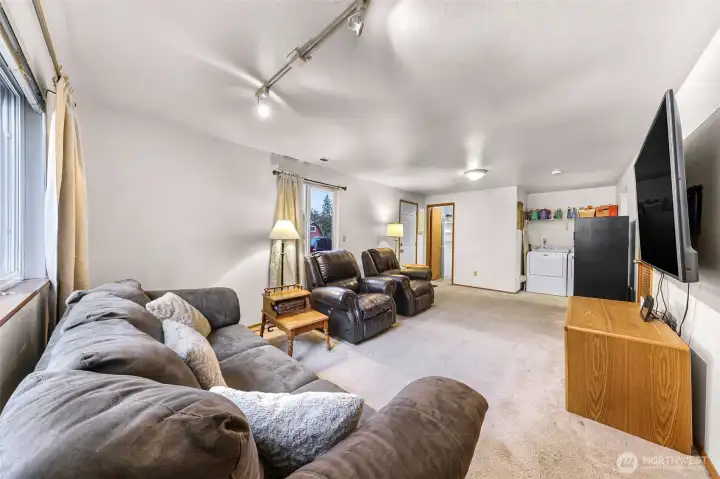 Laundry area and half bathroom off of family/flex space
