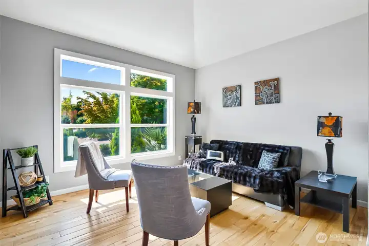 Bright and airy living room with vaulted ceiling.