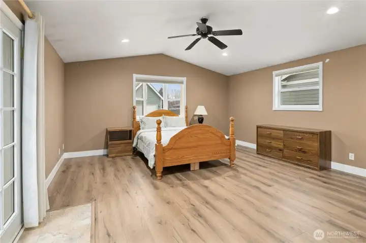 Main Floor Primary bedroom 18"x16' with French Doors that exit to the back deck.