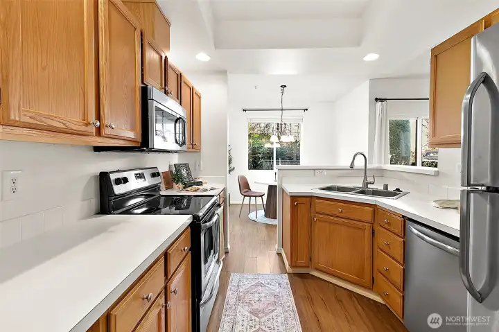 Spacious galley kitchen with newer stainless steel appliances