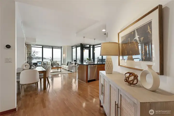 Entry focuses on the open concept and new engineered hardwood flooring.