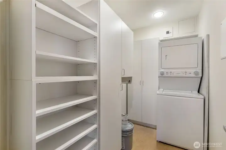 Laundry room with pantry storage cabinet