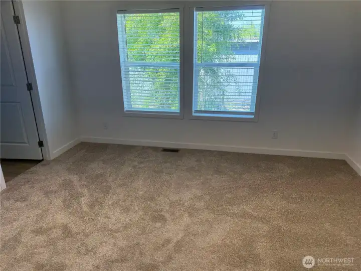 Primary bedroom looking at walk in closet.