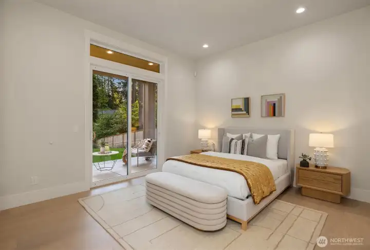 The main-level suite offers privacy, flexibility, and direct access to its own outdoor patio, creating a comfortable retreat for guests or extended family.
