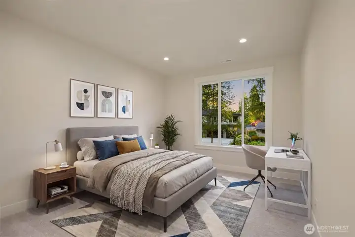 One of three upper-level en-suite bedrooms, this light-filled retreat offers comfort, privacy, and flexibility for guests, loved ones, or evolving household needs. Virtually staged.