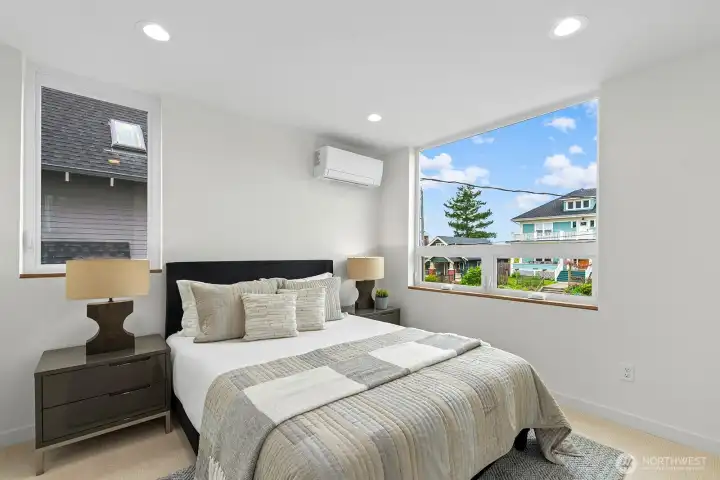 1 of 2 bedrooms on the second level. Photo of model unit, 4116 B Burke Ave N - buyer to verify.