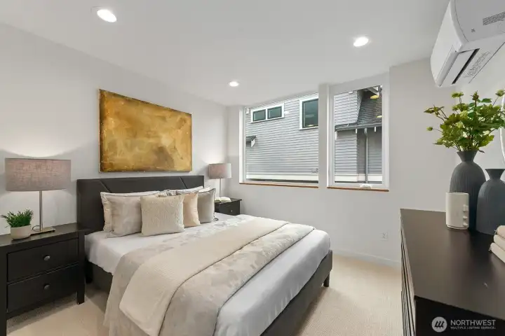 2 of 2 bedrooms on the second level. Photo of model unit, 4116 B Burke Ave N - buyer to verify.