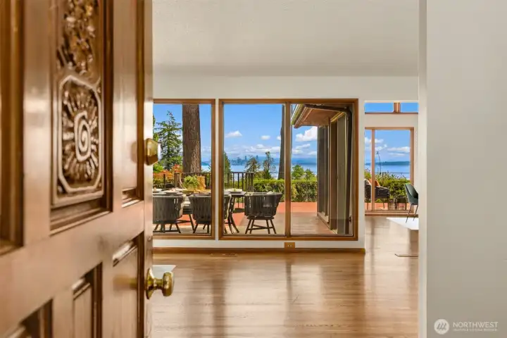 Enter to gorgeous views, hardwood floors, and an open, vaulted living, dining, kitchen layout.