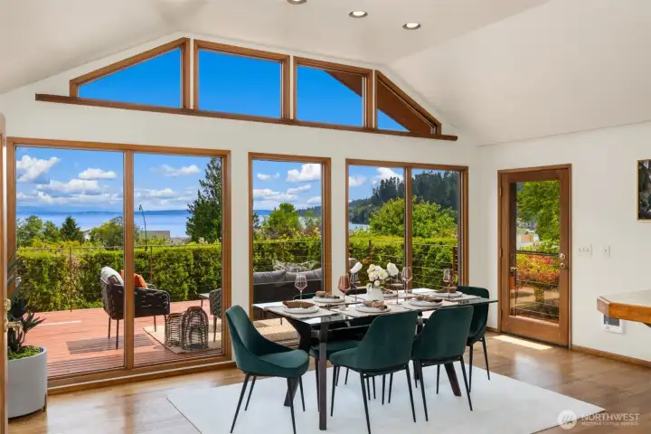 The dining room showcases beautiful views and opens to an expansive deck for effortless entertaining.